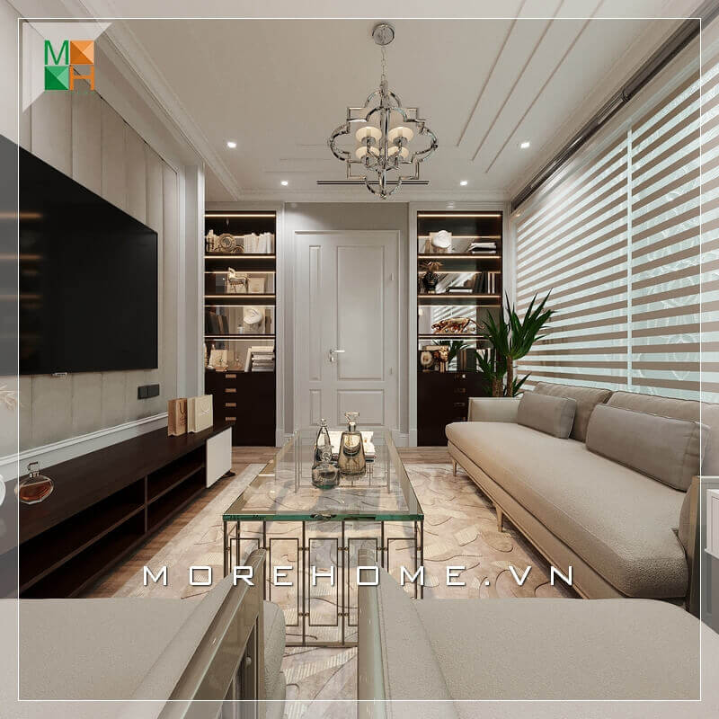 Một phòng khách tân cổ điển đẹp sẽ phải thể hiện được rõ nhất tính năng của nó bằng cách lựa chọn nội thất thông minh và lựa chọn màu sắc phù hợp nhất đối với thiết kế ngôi nhà. Lựa chọn một bộ sofa sang trọng màu kem sữa kết hợp với chiếc bàn bằng kính rất đẳng cấp, Kệ TV nhìn khá đơn giản nhưng rất hài hòa với những nội thất khác trong căn phòng. Sự kết hợp nội thất trong căn phòng khách ăn ý và logic đã tạo nên một không gian phòng khách tiện nghi và sang trọng. Danh sách các mẫu trang trí phòng khách nhà phố sang trọng