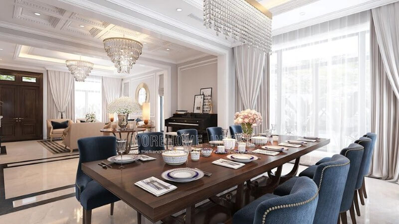 Trang trí phòng ăn liền phòng khách đẹp, sang trọng ấn tượng với sắc xanh nổi bật từ bộ bàn ghế cùng lối thiết kế nội thất tân cổ điển quý phái. Thiết kế nội thất