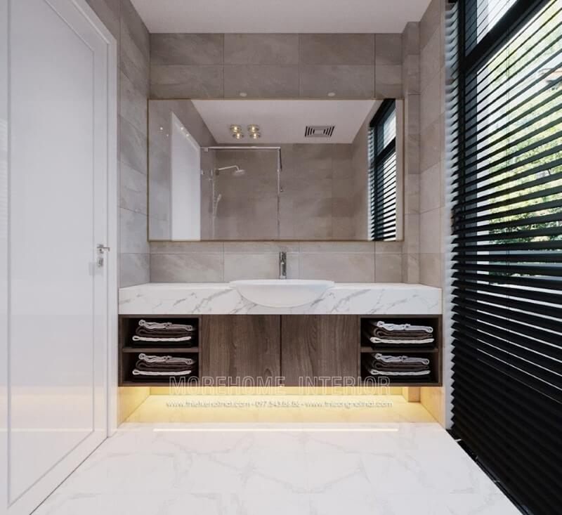 Chọn đá nhân tạo màu trắng vân mây làm ốp mặt lavabo để tạo cảm giác thoáng mát và dễ dàng vệ sinh trong nhà tắm.